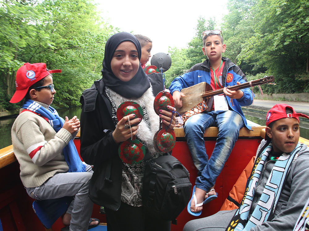 Shore to Shore Festival: Moroccan students play music on a boat during their visit to England