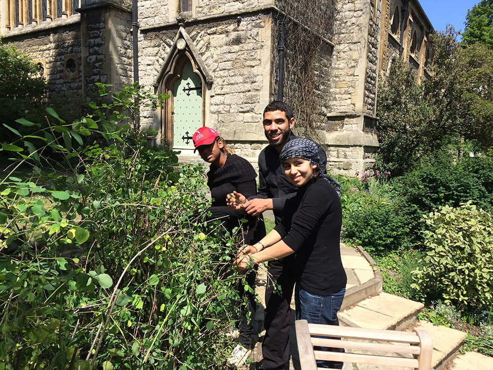 Shore to Shore Festival: Moroccan students gardening in the church grounds during their visit to England